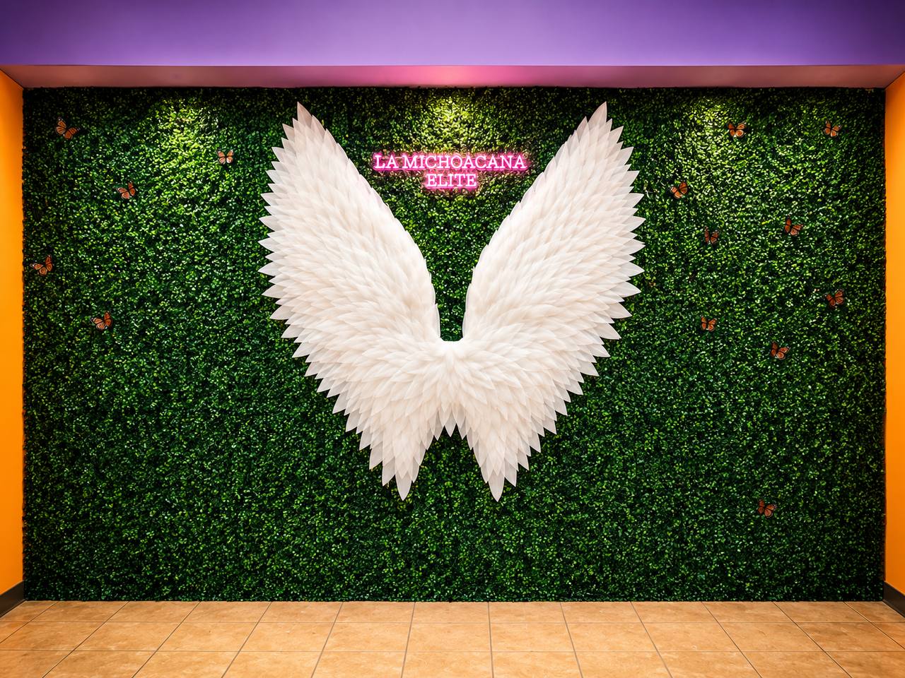 Angel wings feature wall at La Michoacana Elite